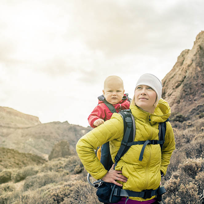 young man standing on the street of a big city and looking at a guide, a tourist in St. Petersburg got lost his way